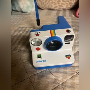 Polaroid Instant Camera with Blue and Rainbow Accents